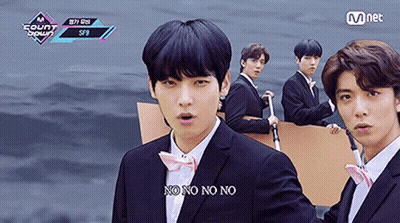 A Group Of Young Men In Suits And Bow Ties Are Standing Next To Each Other And One Of Them Is Saying No No No GIF