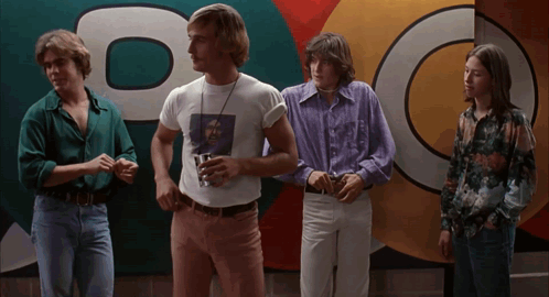 A Group Of Young Men Standing In Front Of A Sign That Says Dc GIF