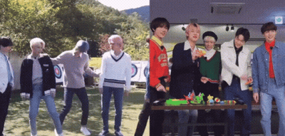 A Group Of Young Men Standing Next To Each Other In Front Of A Table With Toys On It GIF
