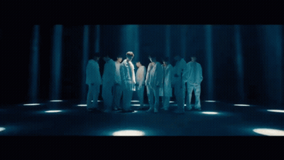 A Group Of Young Men Standing Next To Each Other Wearing White GIF
