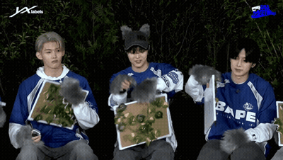 A Group Of Young Men Wearing Blue Shirts With Bape Written On Them GIF