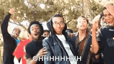 A Group Of Young People Are Dancing Together And One Of Them Is Wearing Glasses And A Hoodie . GIF