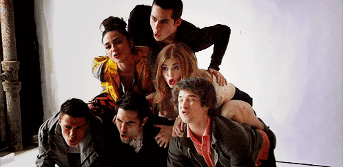 A Group Of Young People Are Posing For A Picture And One Of Them Has A Surprised Look On His Face GIF