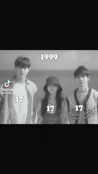 A Group Of Young People Standing Next To Each Other With The Year 1999 On The Bottom Of The Screen GIF