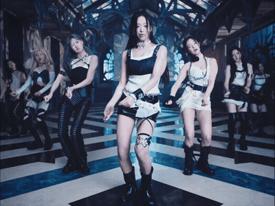 A Group Of Young Women Are Dancing In A Room With A Blue And White Checkered Floor GIF