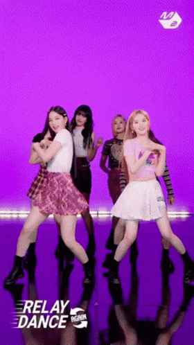 A Group Of Young Women Are Dancing In Front Of A Purple Background That Says Relay Dance On It GIF