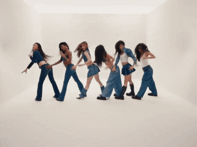 A Group Of Young Women Are Dancing Together And One Of Them Is Wearing A White Tank Top GIF