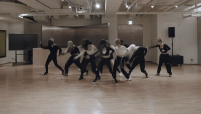 A Group Of Young Women Are Dancing Together In A Dance Studio GIF