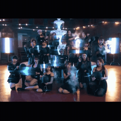 A Group Of Young Women Are Posing For A Picture In Front Of A Pyramid GIF