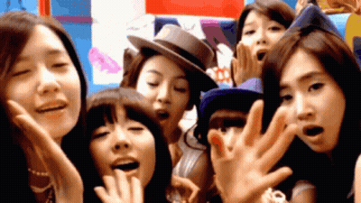 A Group Of Young Women Are Posing For A Picture Together GIF