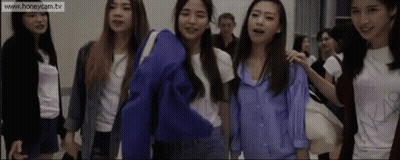 A Group Of Young Women Are Standing Next To Each Other With The Website Www.honeycam.tv At The Bottom GIF