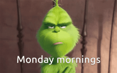 A Grumpy Grinch Says Monday Mornings In White Letters GIF