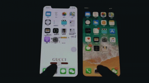A Gucci Phone Is Next To An Iphone GIF
