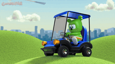 A Gummy Bear Is Driving A Blue Golf Cart On A Hill GIF