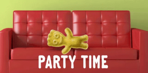 A Gummy Bear Is Laying On A Red Leather Couch With The Words Party Time Below It GIF