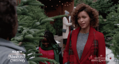 A Hallmark Movie Called Miracles Of Christmas Is Being Shown GIF