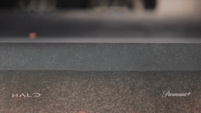 A Halo Advertisement With A Hand Sticking Out Of The Wall GIF