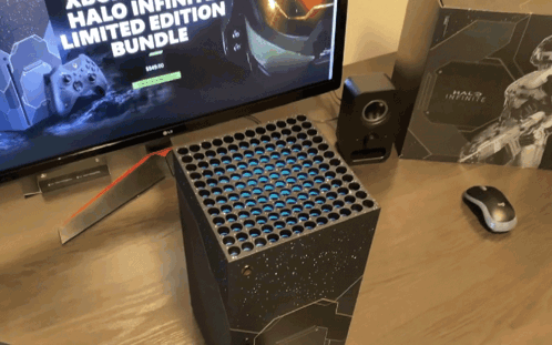 A Halo Infinite Limited Edition Bundle Sits On A Table GIF