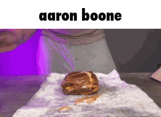A Hamburger On A Piece Of Paper With The Name Aaron Boone Above It GIF
