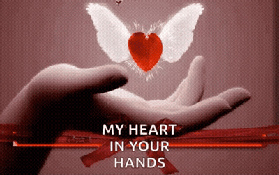 A Hand Holding A Heart With Wings And The Words " My Heart In Your Hands " Below It GIF