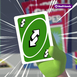 A Hand Is Holding A Green Uno Card With Arrows On It GIF