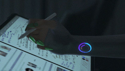 A Hand Is Holding A Pen In Front Of A Computer Screen That Says " Search " GIF
