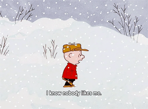 A Hand Is Holding A Piece Of Paper That Says " I Like You Charlie Brown Signed Kimba " GIF