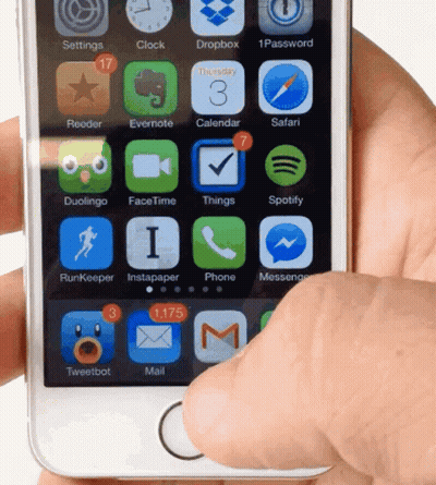 A Hand Is Holding A Smart Phone With The Home Screen Showing Apps Such As Dropbox And Safari GIF