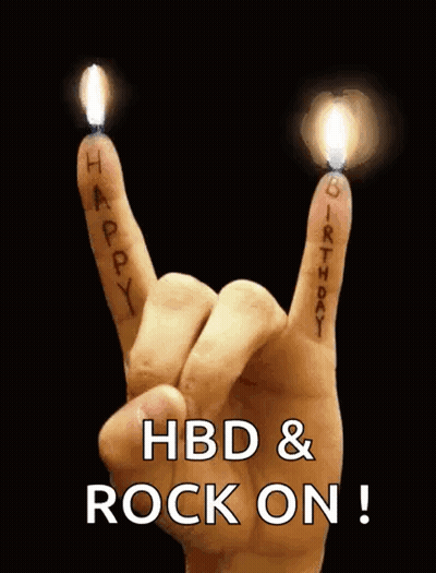 A Hand Is Making A Rock And Roll Sign With Candles On It . GIF