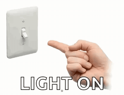 A Hand Is Pressing A Light Switch With The Word Light On Below GIF