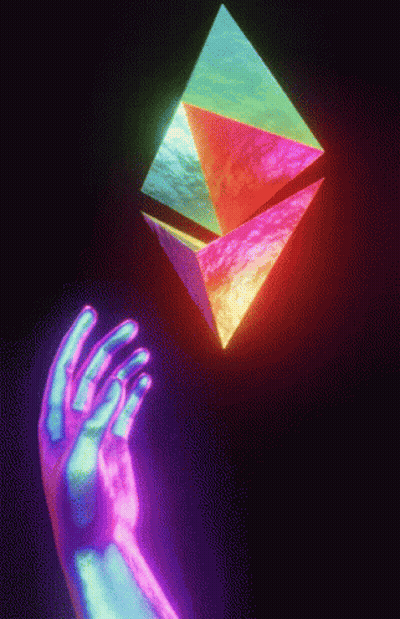 A Hand Is Reaching For A Rainbow Colored Object GIF