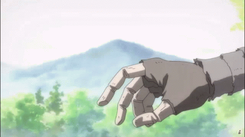 A Hand Is Reaching Out Towards A Mountain GIF