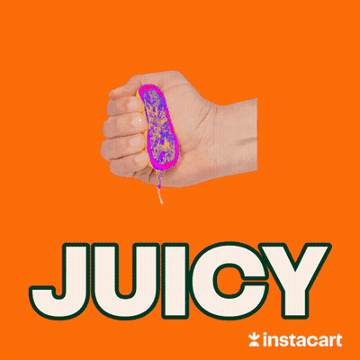 A Hand Is Squeezing A Slice Of Lemon And The Word Juicy Is On A Blue Background GIF