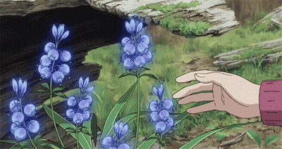 A Hand Reaches Out To Touch A Purple Flower In The Grass GIF