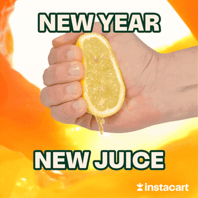 A Hand Squeezing A Slice Of Lemon With The Words New Year New Juice Below It GIF