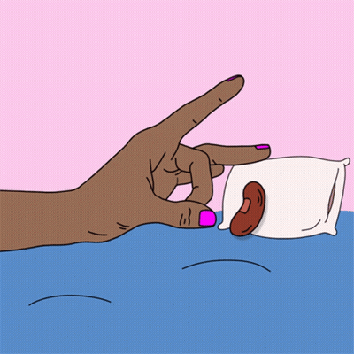 A Hand With Pink Nails Is Reaching For A Pillow With A Sausage On It GIF