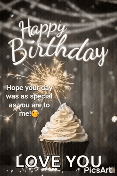 A Happy Birthday Card With A Cupcake And A Sparkler . GIF