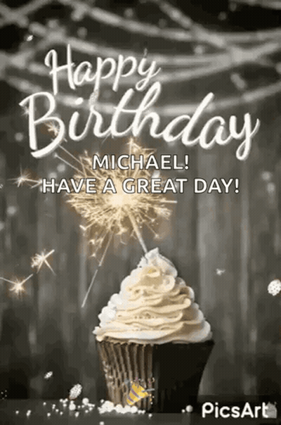A Happy Birthday Michael ! Have A Great Day ! A Cupcake With Whipped Cream And Sparklers . GIF