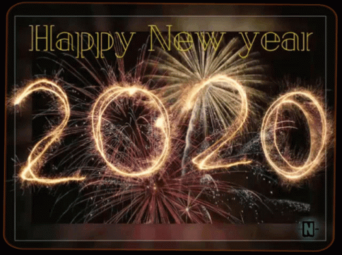 A Happy New Year Greeting Card With Fireworks Behind The Number 2020 GIF