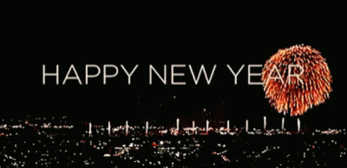 A Happy New Year Greeting With Fireworks Displayed In The Background GIF