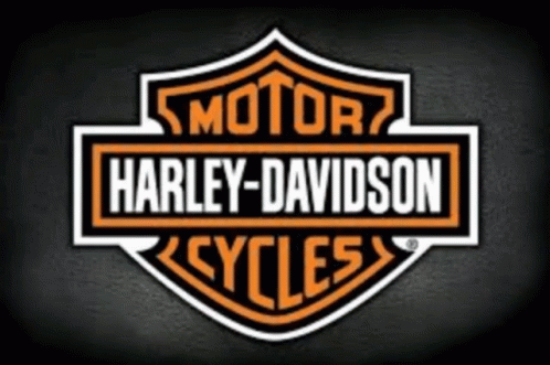 A Harley Davidson Logo Is On A Dark Background GIF