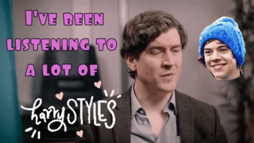 A Harry Styles Poster With A Man Wearing A Blue Hat GIF