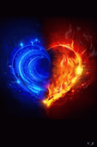 A Heart Made Of Blue And Red Flames On A Black Background . GIF