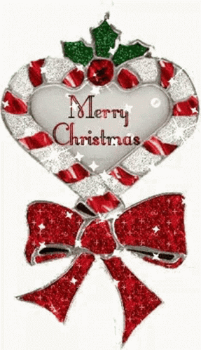 A Heart Shaped Candy Cane With The Words Merry Christmas Written On It GIF