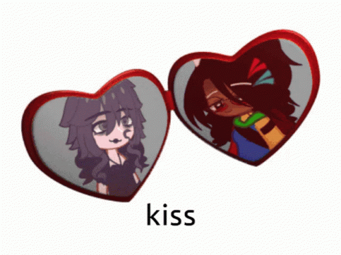 A Heart Shaped Mirror With A Picture Of A Girl And The Word Kiss Underneath It GIF