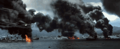 A Helicopter Is Flying Over A Body Of Water With Smoke Coming Out Of It GIF