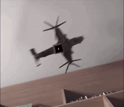 A Helicopter Is Flying Over A Shelf With A Square In The Middle That Says I. GIF