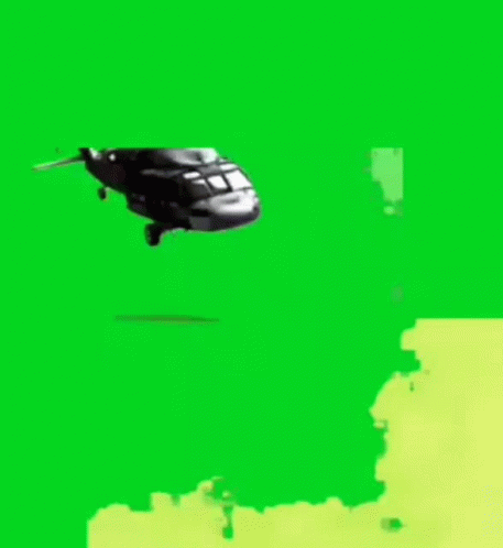 A Helicopter Is Flying Over A Van On A Green Screen GIF
