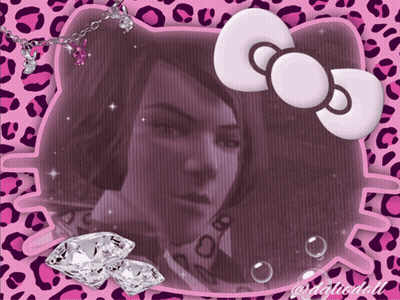 A Hello Kitty Frame With A Picture Of A Girl And Diamonds GIF