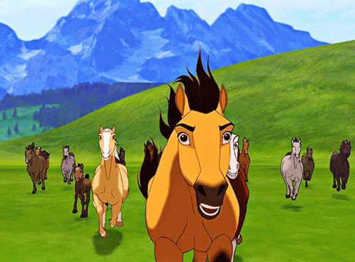 A Herd Of Horses Are Running In A Field With Mountains In The Background GIF